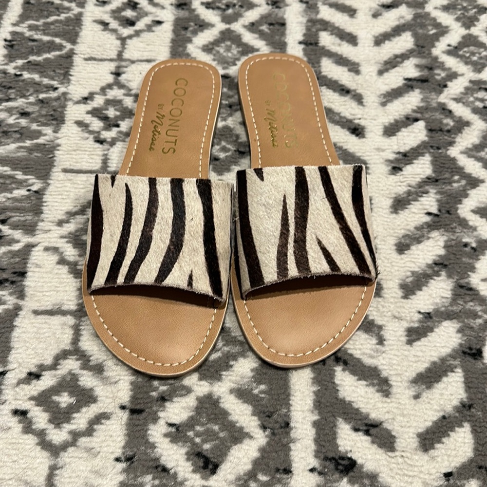 Zebra print slip on sandals